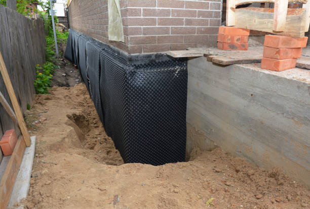 Happy homeowners after waterproofing job in Crooksville